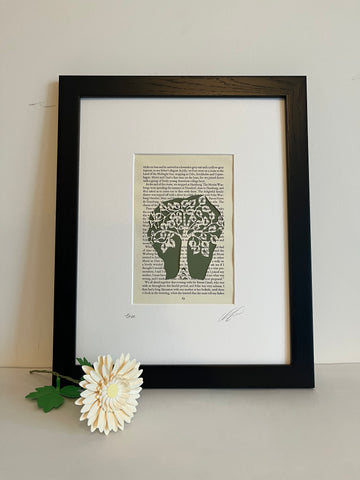Tree — hand-cut paper art on vintage book page